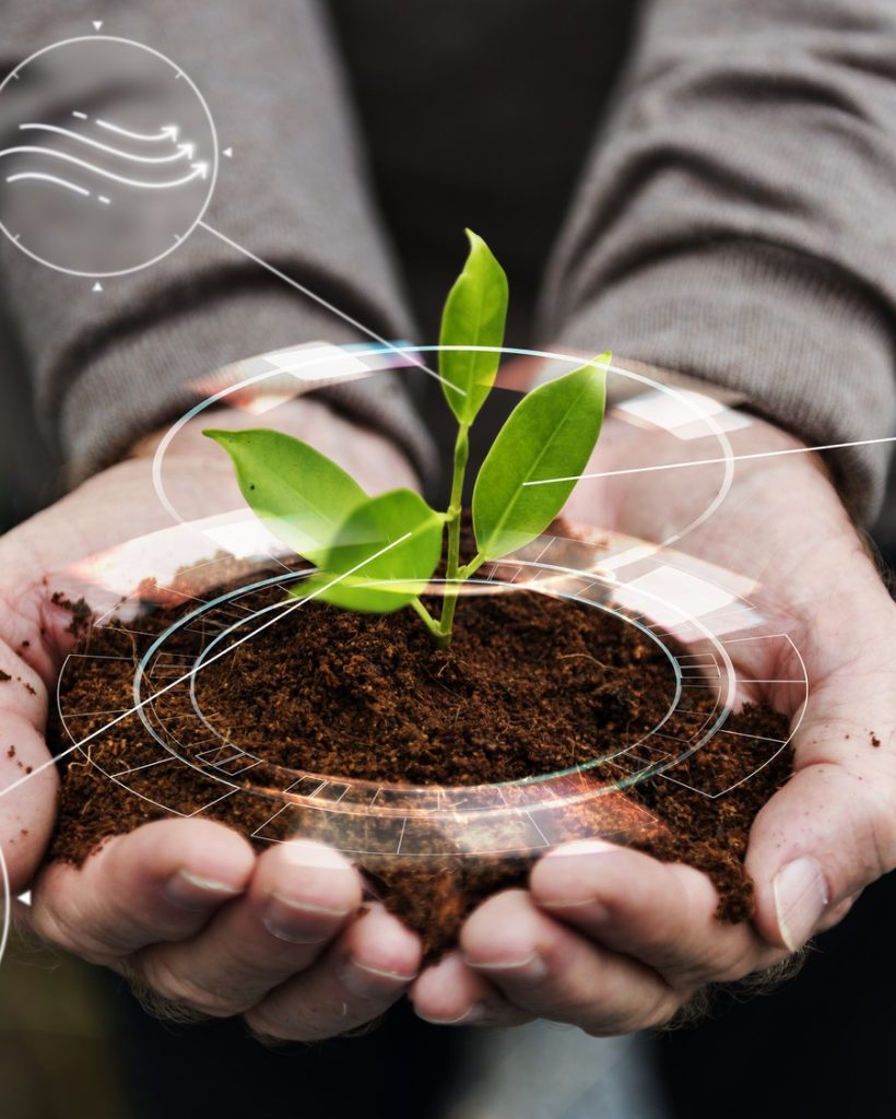 smart-agriculture-iot-with-hand-planting-tree-background